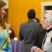 Two guests speaking to each other.